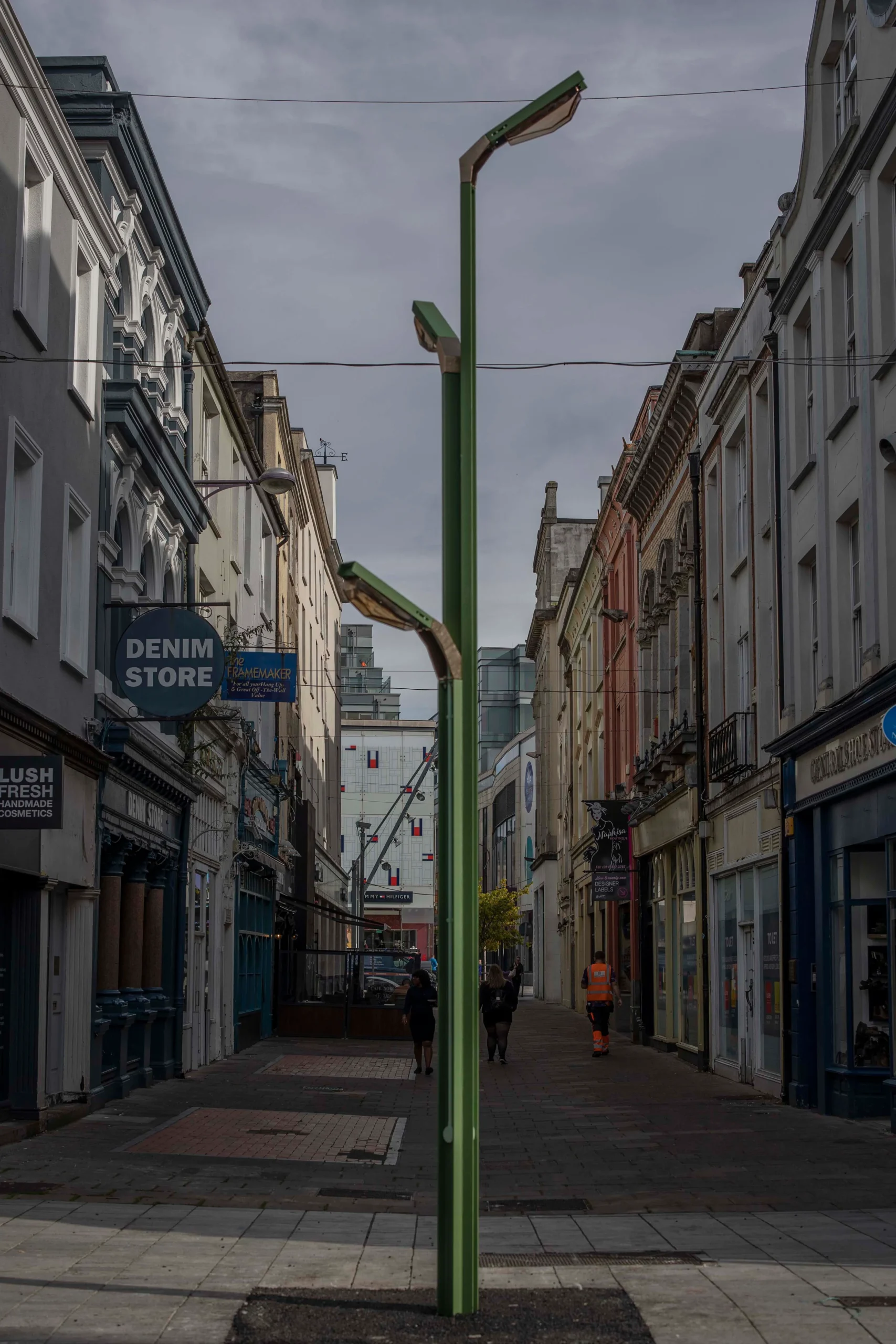 A large green three headed lighting feature titled Boom Nouveau in Cork City Center.