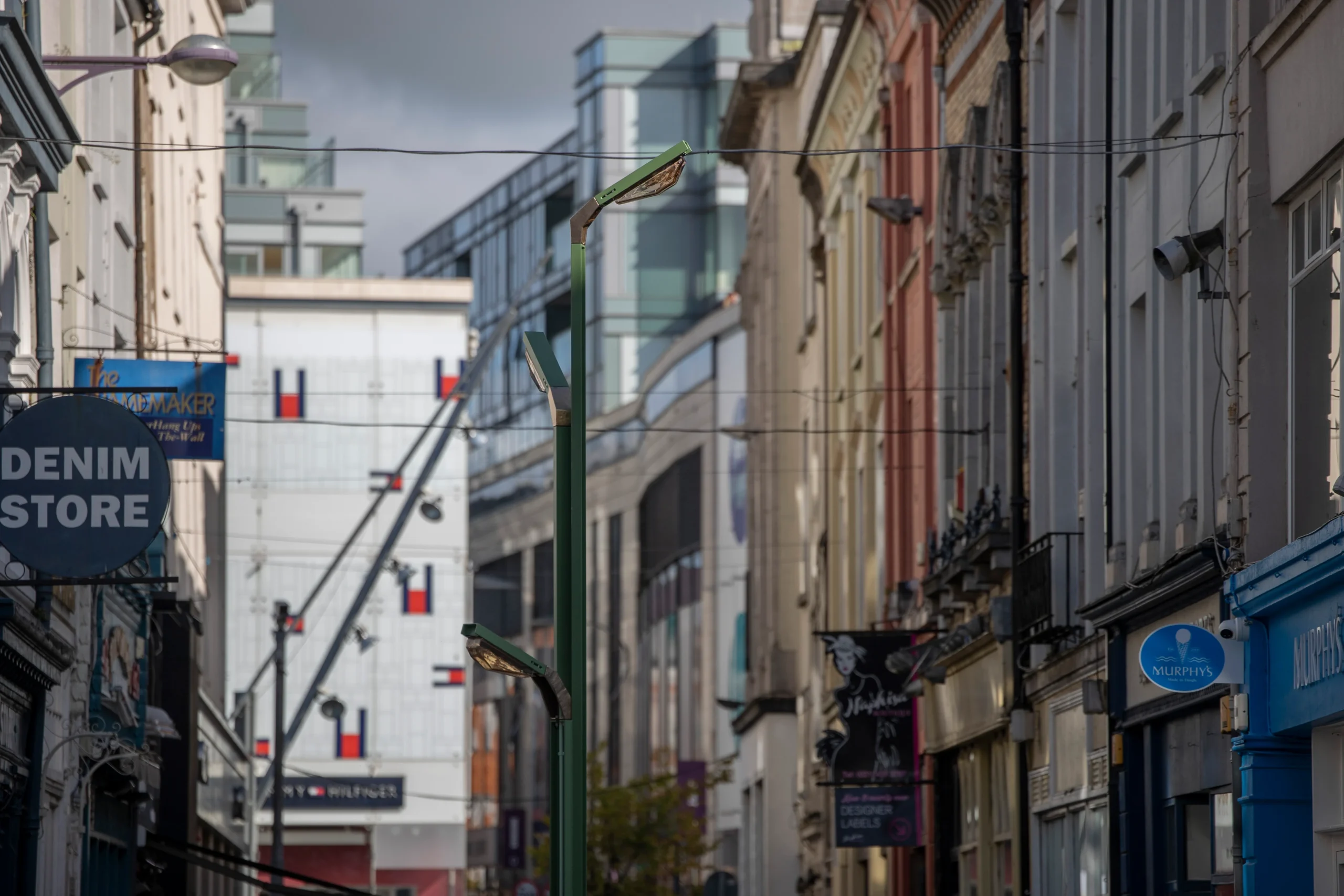 A large green three headed lighting feature titled Boom Nouveau in Cork City Center.